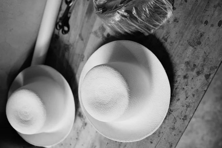 Two Montecristi Panama Hats by DOmingo Carranza Hats starting the customisation process